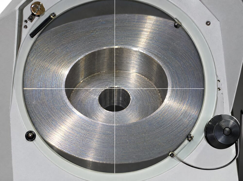 Face detail lit from above on a Fowler Baty optical comparator