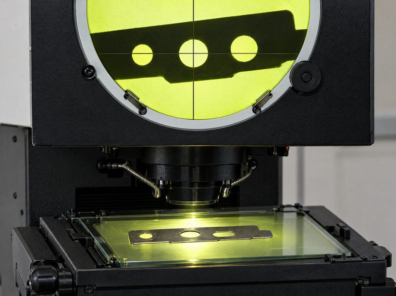 Flat stamping on the glass stage of a Fowler Baty optical comparator