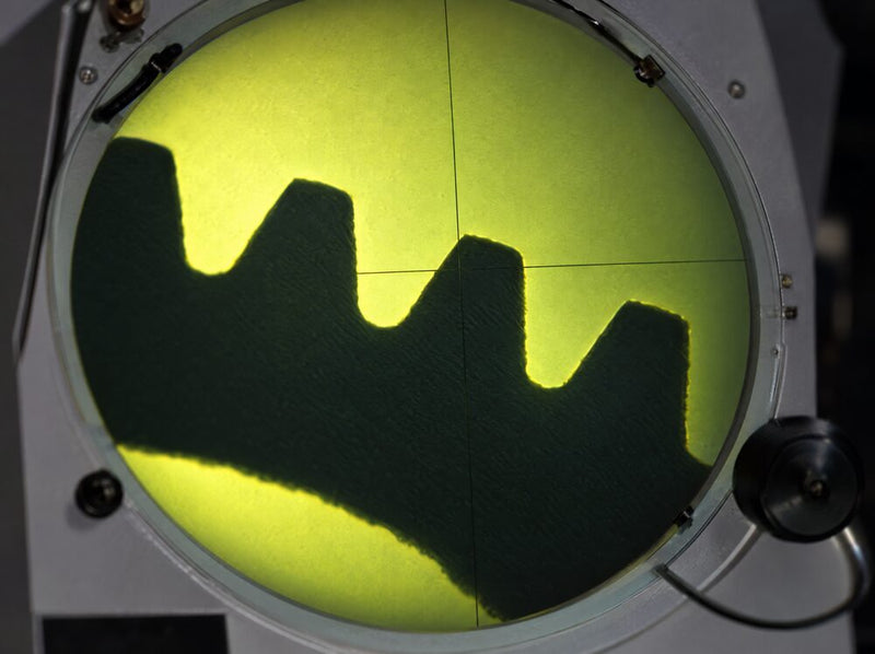 Small gear teeth profile magnified on a Fowler Baty optical comparator